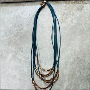 Turquiose beaded neckpiece with nylon strings